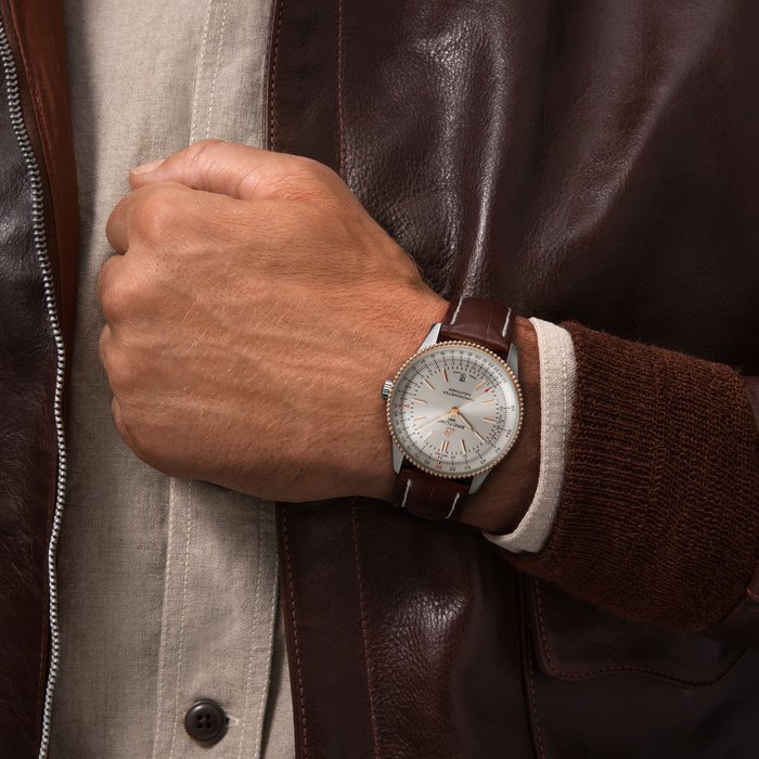 Refined and elegant, the Navitimer Automatic 41 combines the historic appeal of a true icon with the sophistication of a contemporary timepiece.
Available in a variety of materials including stainless steel and 18k red gold, the 41 mm case features a beaded bezel and a range of elegant dial colors. Offered either with a matching bracelet or alligator strap that fits both a stainless-steel pin or folding buckle, the Navitimer Automatic 41 is powered by the Breitling Caliber 17, a COSC-certified chronometer.