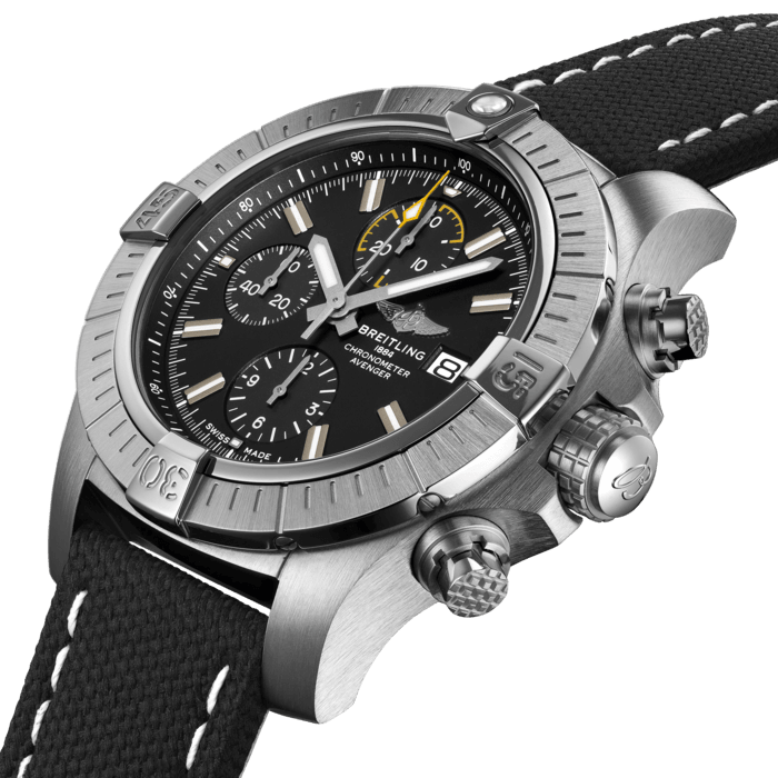 Bold, extremely robust and shock resistant, the Avenger Chronograph 45 combines precision with a powerful design. As a true Breitling Avenger, it can be used wearing gloves and offers unrivalled safety and reliability to any airborne adventurer. The Avenger Chronograph 45 features a sturdy 45mm stainless-steel case, black or blue dial and a choice of a stainless-steel bracelet, or matching black or blue military leather strap that fits either a stainless-steel pin buckle or folding clasp. Thanks to its rugged bezel and its special grip-pattern on the crown & chronograph pushers, the Avenger Chronograph 45 can be easily operated wearing gloves.