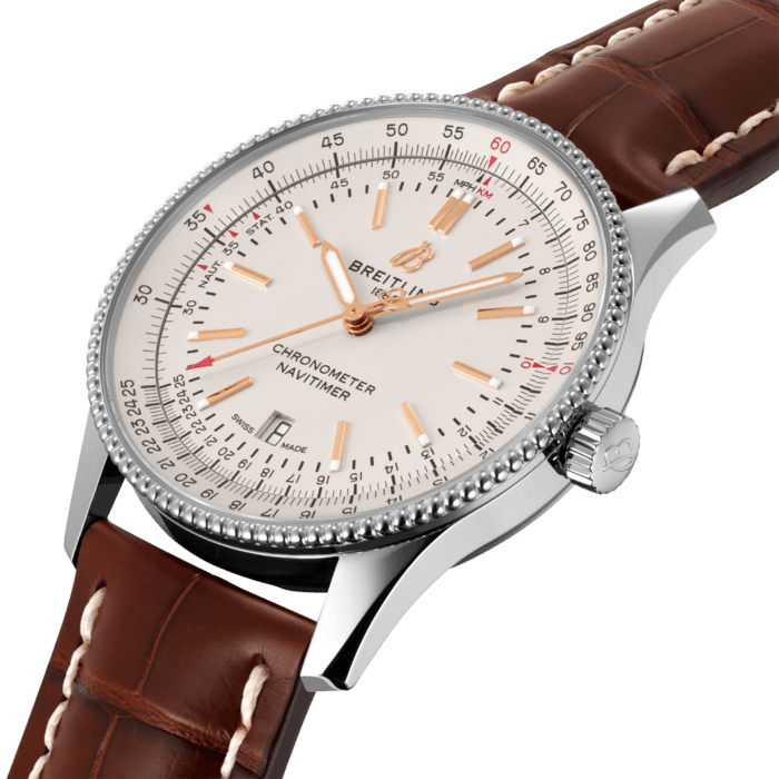Refined and elegant, the Navitimer Automatic 41 combines the historic appeal of a true icon with the sophistication of a contemporary timepiece.
Available in a variety of materials including stainless steel and 18k red gold, the 41 mm case features a beaded bezel and a range of elegant dial colors. Offered either with a matching bracelet or alligator strap that fits both a stainless-steel pin or folding buckle, the Navitimer Automatic 41 is powered by the Breitling Caliber 17, a COSC-certified chronometer.