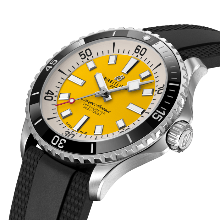 Performance and style for all your water-based pursuits—now in a special online exclusive with yellow dial.
In the 1960s, the new sport of scuba diving was all the rage. For divers, timing was everything, and Breitling set out to give them the most clear-cut dive watch possible by eliminating any feature that didn’t support their lifesaving needs underwater. This pared-down watch was named the Slow Motion. What remained were clean lines, chunky luminescent indexes, squared-off hands and a high-contrast dial ring, all aimed at maximum legibility. Practical, yes. But what people really fell in love with was the look.
The new Superocean retraces the Slow Motion's celebrated design codes, while adding modern features, like a ceramic-inlayed bezel and brightly colored dials. Broad hands and indexes in luminescent Super-LumiNova® allow for easy readability underwater. This special Breitling online exclusive features an eye-catching yellow dial. It’s water resistant to 300 m (1000 ft), as well as being shock-, sand- and saltwater-resistant. The two strap options (rubber and metal bracelet) have a folding clasp that allows for micro-adjustments of up to 15 mm for easy wear over rashies and wetsuits. Its scratch-proof ceramic inlayed bezel will never wear or fade. For safety, the bezel is uni-directional on most sizes and bi-directional with a patented lock on the 46 mm.
Best of all, this is no longer strictly a dive watch—surf with it, swim with it, hit the beach bar with it, then wear it out to dinner. The Superocean perfectly balances the nostalgia of its heritage with a fresh new look.