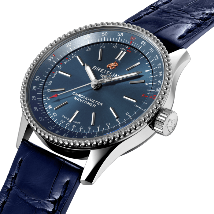 Refined and elegant, the Navitimer Automatic 35 combines the historic appeal of a true icon with the sophistication of a contemporary timepiece.
Available in a variety of materials including stainless steel and 18k red gold, the 35 mm case features a beaded bezel and a range of elegant dial colors, as well as diamond-set white mother of pearl. Offered either with a matching bracelet or alligator strap that fits both a stainless steel pin or folding buckle, the Navitimer Automatic 35 is powered by the Breitling Caliber 17, a COSC-certified chronometer.