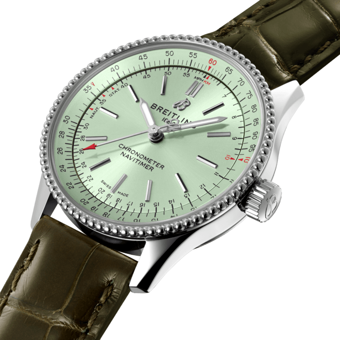 Refined and elegant, the Navitimer Automatic 35 combines the historic appeal of a true icon with the sophistication of a contemporary timepiece.
Available in a variety of materials including stainless steel and 18k red gold, the 35 mm case features a beaded bezel and a range of elegant dial colors, as well as diamond-set white mother of pearl. Offered either with a matching bracelet or alligator strap that fits both a stainless steel pin or folding buckle, the Navitimer Automatic 35 is powered by the Breitling Caliber 17, a COSC-certified chronometer.