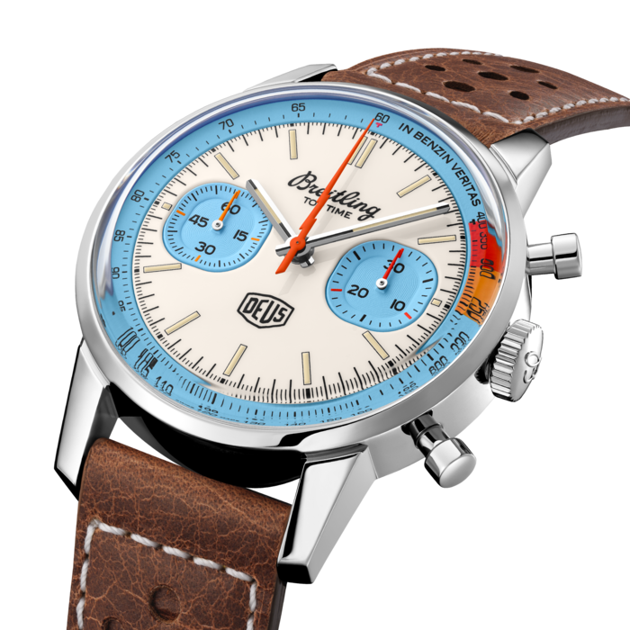 Co-designed with Australian lifestyle brand Deus Ex Machina, the custom motorcycle and surf outfitter, the Top Time Deus is a nod to Breitling’s original 1960s watch and a true tribute to the nomad spirit. Originally launched in the 1960s, the Top Time had a clear mission: to suit the needs of “the young and active professionals” with a range of “ultra-modern chronographs”. The sports watch appealed not only to that demographic, but also to those attracted by its bold lines.
The Top Time Deus will appeal to bikers, boarders and backpackers, all looking for the freedom to explore the world their own way, at their own pace. Featuring a 41-millimetre stainless-steel case matched to a brown racing-themed calfskin leather strap, the Top Time Deus features yellow and orange details, a lightning-bolt-shaped chronograph hand on top of squircle-shaped chronograph counters, Deus’ adage “In benzin veritas” and a retro-looking motorcyclist in rally racer mode - by Deus creative director Carby Tuckwell - engraved on the caseback. Limited to 2000 pieces, this Top Time is powered by the Breitling Caliber 23, a COSC-certified chronometer.