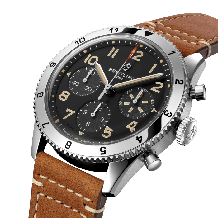 From brave first takeoffs to the birth of commercial air travel, Breitling’s history is inseparable from that of flight. In the 1930s, Breitling’s Huit Aviation department made its name inventing precision cockpit clocks. Two decades later, it introduced yet another novel flight instrument, this time in wearable form: the Ref. 765 AVI. That pioneering pilot’s watch provided the technical backdrop for today’s Classic AVI, a collection inspired by the rugged spirit of famed early aircraft.
The Classic AVI P-51 Mustang honors one of those legends. When the aircraft was built in a mere 120 days, even its developer North American Aviation, didn’t anticipate what a powerhouse it had on its hands. The P-51’s low-drag wings and engine-cooling system—considered experimental when the single-seat fighter first took off in 1940—gave it unprecedented speed and range. The addition of a Merlin engine, expanded the plane’s performance to high altitudes, making it the best all-purpose fighter of its time.
As a true pilot’s watch designed to withstand the rigors of a vintage cockpit, the Classic AVI P-51 Mustang features large, highly legible Arabic numerals on the dial and bezel.
The knurled bezel on the 42mm case provides optimal grip, even in a pilot’s gloved hands. Top-stitched calfskin straps give a nod to the seams found on classic flight gear, while the stainless-steel bracelet provides an elegant alternative. Pilots and other travelers will appreciate its legibility, wearability, and understated style. The engine of the Classic AVI is the COSC-certified Breitling Caliber 23 movement, which provides approximately 48-hours of power reserve.
