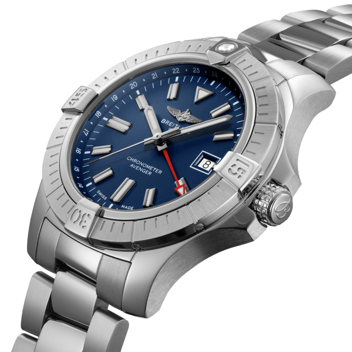Bold, extremely robust and shock resistant, the Avenger Automatic GMT 45 features an additional red hand indicating a second time zone. As a true Breitling Avenger, it can be used wearing gloves and offers unrivalled safety and reliability to any airborne adventurer. The Avenger Automatic GMT 45 features a sturdy 45mm stainless-steel case, blue dial and a choice of a stainless-steel bracelet, or a blue military leather strap that fits either a stainless-steel pin buckle or folding clasp. Thanks to its rugged bezel and its special grip-pattern on the crown, the Avenger Automatic GMT 45 can be easily operated wearing gloves.