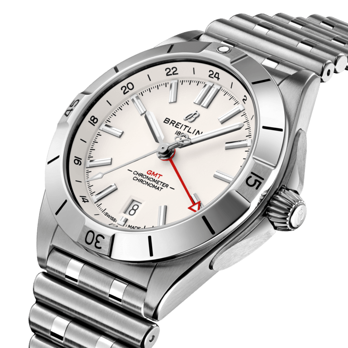 The Chronomat Automatic GMT 40 is Breitling’s tribute to travel, not only for its dual time zone display, but also because of its easygoing aesthetics. Subtle dial colors, combined with an all-steel case and bracelet, work with any wardrobe. Meanwhile, the tone-on-tone 24-hour scale lets the red GMT hand speak for itself.
The Breitling Caliber 32 powers the GMT complication. Its 24-hour scale lets the user track a second time zone and know at a glance whether it’s day or night, while the “onion” crown (a classic Chronomat feature named for its fluted-dome shape) allows for easy adjustments. As an all-purpose sports watch, meant to cross over between Breitling’s air, land and sea universes, the GMT 40 has an impressive 200m water resistance.
Known as “a watch for every pursuit,” the Chronomat mission is truer now than ever because of the GMT 40’s practical size and understated style. Sturdy enough for the gym, yet smart enough for black tie: If there’s one watch to travel with, this is it.