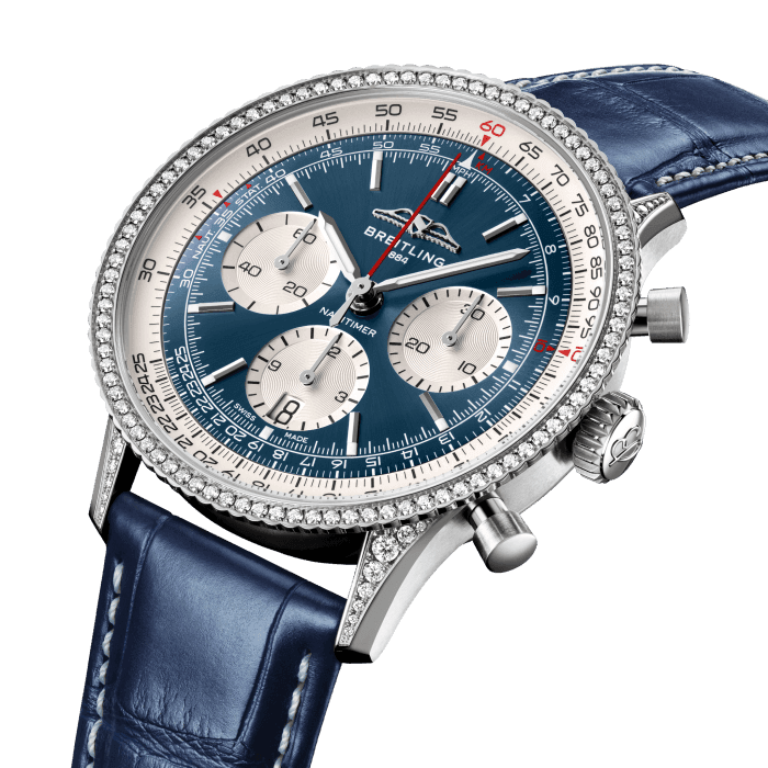 Breitling’s iconic pilot’s chronograph – for the journey.
In 1952, Willy Breitling developed a wrist-worn chronograph with a circular slide rule that would allow pilots to perform all necessary flight calculations. Two years later, the Aircraft Owners and Pilots Association (AOPA) announced the design as its official timepiece. The “navigation timer” – or Navitimer – was born.
The AOPA was (and remains) the largest pilots’ club in the world, counting nearly every US aviator among its ranks. As the defacto pilot’s watch throughout the glory days of civil aviation, the Navitimer was worn by airline captains and aircraft enthusiasts. It even made its way into space on the wrist of astronaut Scott Carpenter in 1962. And it wasn’t only pilots drawn to the watch’s irrepressible aesthetic. Celebrities of the day such as Miles Davis and Serge Gainsbourg were devotees, proving that the Navitimer had style as well as function.
There have been many iterations of Breitling’s icon since its debut 70 years ago, but this new Navitimer captures its most classic features, while enhancing them with modern refinements. A flattened slide rule and a domed crystal create the illusion of a sleeker profile. Alternating polished and brushed metal elements give a lustrous, yet understated finish. Most notably, new colors in shades of blue, green and copper, define the updated dial options. And if there is one update sure to spark nostalgia, it’s the return of the AOPA wings to their original position at 12 o’clock.
For 70 years, Breitling’s original pilot’s watch has been beloved by aviators and tastemakers in equal measure. Worn by astronauts in space and the biggest stars on earth, it is Breitling’s most iconic timepiece and one of the most recognizable watches of all time.