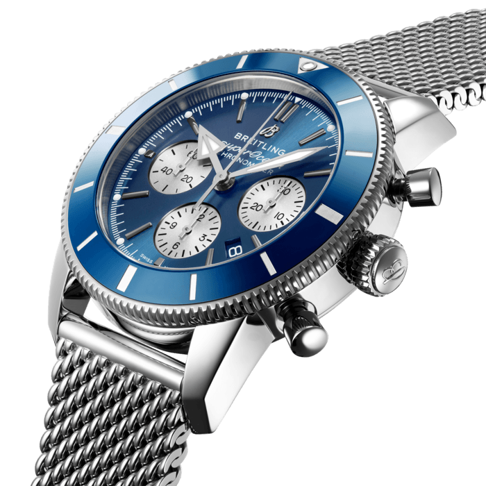 Inspired by the original Superocean from the 1950s, the Superocean Heritage combines iconic design features with a modern touch. Sporty and elegant, the Superocean Heritage is a true embodiment of style at sea.
Featuring the iconic triangular-shaped hands as well as a unidirectional bezel with a polished ceramic ring, the Superocean Heritage is an elegant looking diver’s watch. Available in a variety of materials including stainless steel and 18k red gold, the Superocean Heritage B01 Chronograph 44 features a range of black, blue, silver, or green dials. Offered either with a matching mesh bracelet, or a “mesh-styled” rubber strap fitting a folding buckle, this Superocean Heritage is powered by the in-house Breitling Manufacture Caliber 01, a COSC-certified chronometer.