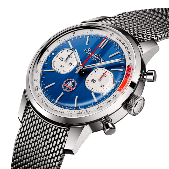 The 1960s was a decade of experimentation, fun, freedom and energy. Whether cruising on a motorcycle or revving up a sportscar, living life at full speed was the order of the day. Willy Breitling felt this change of pace and set out to design an unconventional chronograph that would capture the verve of era. He called it the Top Time.
That spirited tradition continues today with Breitling partnering with some of the coolest names in wheels to create its Top Time designs. In the early 1960s, the Le Mans winner Carrol Shelby imagined a car that matched a small, light British-style chassis to a strong, reliable American big-block engine. When it was introduced in 1962, the Cobra met with instant success, both among sportscar fans and on the racing circuit. It remains blisteringly fast and cherished by collectors to this day.
The Top Time B01 Shelby Cobra features the colors and emblem of its classic-car counterpart as well as a perforated leather racing strap, speed-measuring tachymeter scale and contrasting “squircle” (not quite square, not quite round) subdials that give the feel of vintage dashboard gauges. It also comes with a brag-worthy engine under the hood: the exceptional Breitling Manufacture Caliber 01.