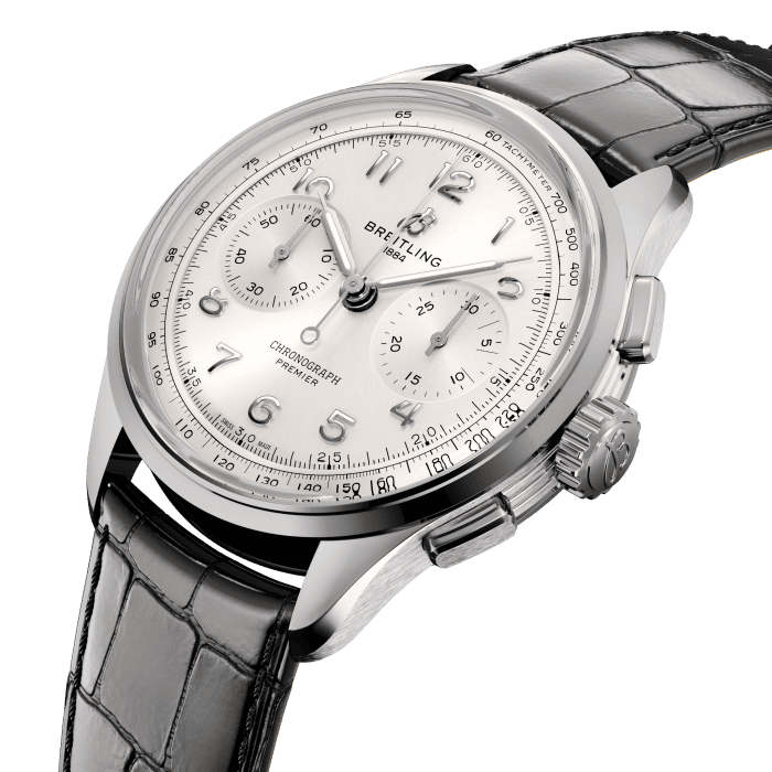 Paying homage to three generations of inventors—Léon, Gaston, and Willy Breitling—the Premier collection embodies Breitling’s legacy as the inventor of the modern chronograph. As Willy Breitling put it, the Premier is the “unmistakable stamp of impeccable taste.”
The modern Premier collection brings this history back to life while showcasing Breitling’s highest level of watchmaking. It comes a range of complications: the Chronograph, the Duograph split-second, the Datora full calendar and the Tourbillon.
The Premier Chronograph’s heritage-revived design features a variety of elegant design details, such as grooves on the case sides, rectangular pushers, applied Arabic numerals and vintage-inspired hands. It also features an open sapphire caseback that beautifully displays the manually wound COSC-certified Breitling Manufacture Caliber B09.