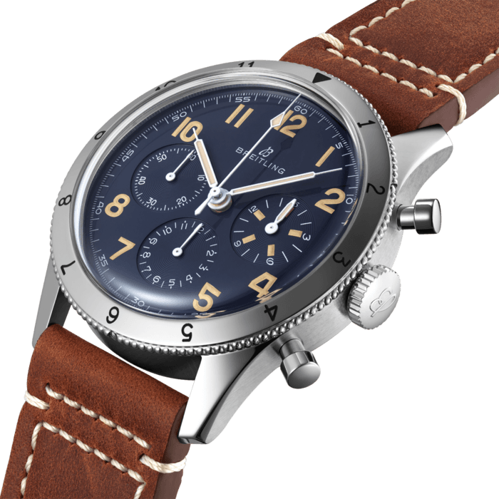 Back in the 1950s, the original Co-Pilot Ref. 765 AVI starred next to another Breitling icon: the Navitimer. With its bold design, engraved rotating bezel and extra legible dial the 765 AVI instantaneously became the perfect companion to the Navitimer as the rugged and reliable pilots’ watch.
Today, the AVI 1953 Edition offers a luxury twist on the original design of the Co-Pilot Ref. 765 AVI from 1953.
The all-blue dial, protected by a highly-domed Hesalite crystal, has the same Arabic numerals than the original Co-Pilot, with tone-on-tone small second, 15-minute and 12-hour chronograph counters. The hand-applied Super-LumiNova color has been carefully chosen to recall the original luminescent material and gives the AVI 1953 Edition an additional touch of vintage allure. The AVI 1953 Edition features a 41mm platinum case with a water resistance up to 3 bar (30 meters).
The AVI 1953 Edition is powered by the in-house Breitling Manufacture Caliber B09, a hand-wound COSC-certified caliber based on the renowned Breitling Caliber 01. It is available on a gold vintage-inspired leather strap with an 18k white gold pin buckle as a limited-edition of 153 pieces, each of which is engraved “ONE OF 153”.
