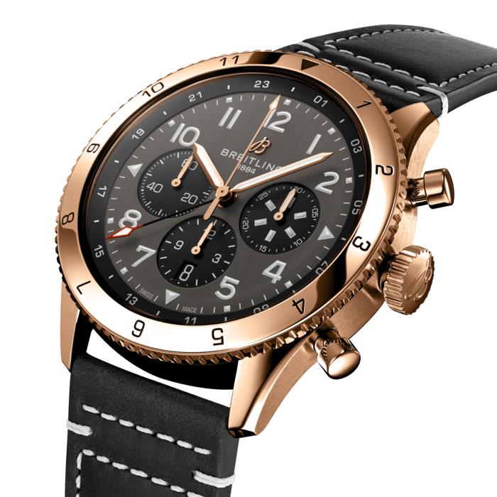 From brave first takeoffs to the birth of commercial air travel, Breitling’s history is inseparable from that of flight. In the 1930s, Breitling’s Huit Aviation department made its name inventing precision cockpit clocks. Two decades later, it introduced yet another novel flight instrument, this time in wearable form: the Ref. 765 AVI. That pioneering pilot’s watch provided the technical backdrop for today’s Super AVI, a collection inspired by the rugged spirit of famed early aircraft.
The Super AVI P-51 Mustang honors one of those legends. When the aircraft was built in a mere 120 days, even its developer North American Aviation, didn’t anticipate what a powerhouse it had on its hands. The P-51’s low-drag wings and engine-cooling system—considered experimental when the single-seat fighter first took off in 1940—gave it unprecedented speed and range. The addition of a Merlin engine, expanded the plane’s performance to high altitudes, making it the best all-purpose fighter of its time.
As a true pilot’s watch designed to withstand the rigors of a vintage cockpit, the Super AVI P-51 Mustang features large, highly legible Arabic numerals on the dial and bezel. Its sturdy case measures 46mm and the oversized crown sits at 3 o’clock. Knurled bezels provide optimal grip and top-stitched calfskin straps give a nod to the seams found on classic flight gear. Pilots and other travelers will appreciate the ability to track a second time zone using the 24-hour marking on the inner bezel and the red-tipped GMT hand. The engine of the Super AVI is the COSC-certified Breitling Manufacture Caliber B04 movement, which provides approximately 70-hours of power reserve.