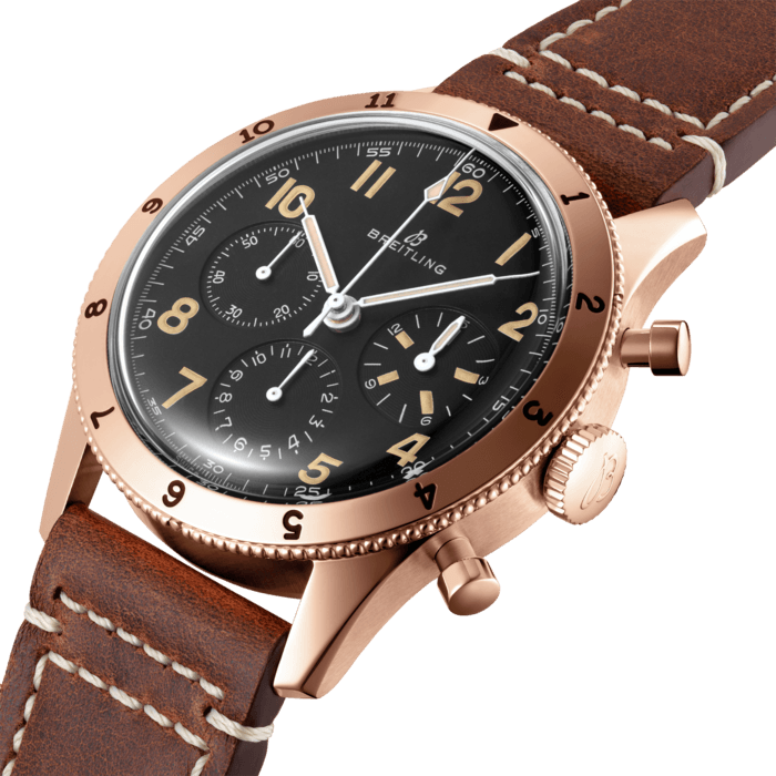 Back in the 1950s, the original Co-Pilot Ref. 765 AVI starred next to another Breitling icon: the Navitimer. With its bold design, engraved rotating bezel and extra legible dial the 765 AVI instantaneously became the perfect companion to the Navitimer as the rugged and reliable pilots’ watch.
Today, the AVI 1953 Edition offers a luxury twist on the original design of the Co-Pilot Ref. 765 AVI from 1953.
The all-black dial, protected by a highly-domed Hesalite crystal, has the same Arabic numerals than the original Co-Pilot, with tone-on-tone small second, 15-minute and 12-hour chronograph counters. The hand-applied Super-LumiNova color has been carefully chosen to recall the original luminescent material and gives the AVI 1953 Edition an additional touch of vintage allure. The AVI 1953 Edition features a 41mm 18k red gold case with a water resistance up to 3 bar (30 meters).
The AVI 1953 Edition is powered by the in-house Breitling Manufacture Caliber B09, a hand-wound COSC-certified caliber based on the renowned Breitling Caliber 01. It is available on a brown vintage-inspired leather strap with an 18k red gold pin buckle as a limited-edition of 253 pieces, each of which is engraved “ONE OF 253”.