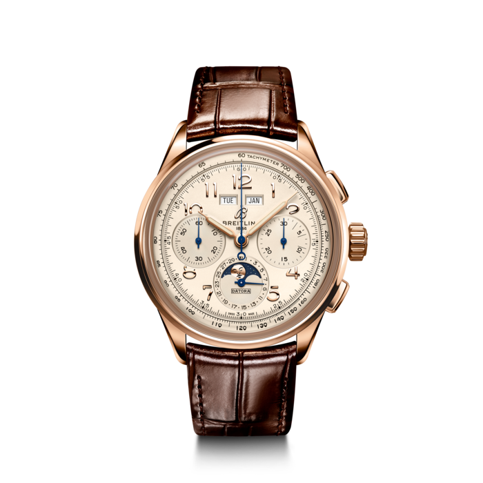 Paying homage to three generations of inventors – Léon, Gaston & Willy Breitling – the Premier Datora is the most refined Breitling chronograph with its complete calendar and moon-phase. As Willy Breitling said, the Premier is an “unmistakable stamp of impeccable taste”.
This latest generation of Premier chronographs brings its timeless elegance back to life, and showcases Breitling’s highest level of watchmaking thanks to a range of iconic Premier complications: the Chronograph, the Duograph and the Datora.
Featuring rectangular chronograph pushers and Arabic numerals, the heritage-revived Premier Datora displays a variety of elegant design details such as grooves on the case-sides, open sapphire casebacks and vintage-inspired hands.
The Datora comes in two variations: in stainless steel with a copper dial and a brown alligator strap or in 18k red gold with a silver dial and a brown alligator strap. “Datora” was a term used by Breitling in the 1940s and refers to a complete calendar chronograph displaying day, date, month and the different moon phases. The Datora is powered by the cosc-certified Manufacture Caliber B25.