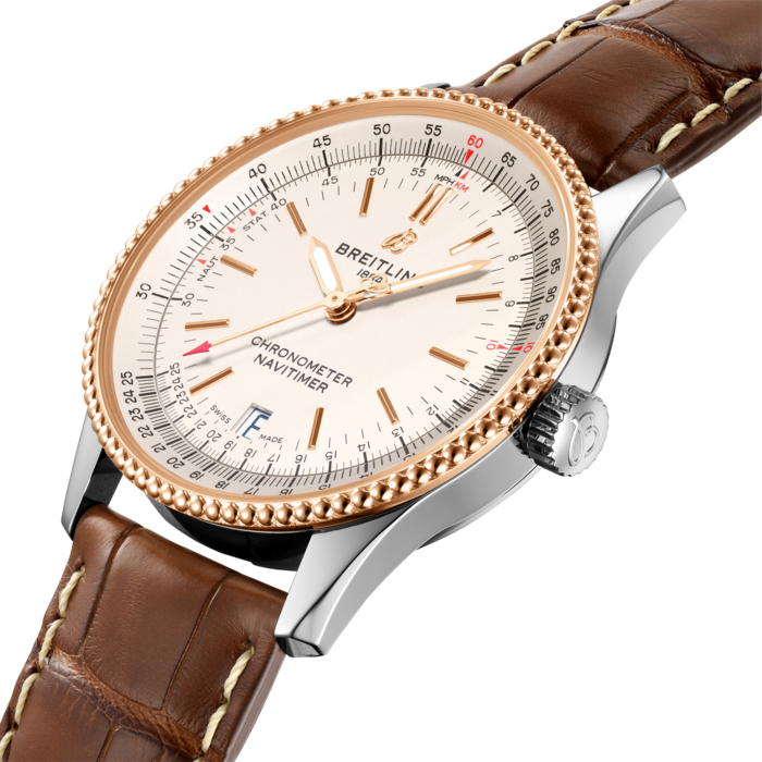 Refined and elegant, the Navitimer Automatic 38 combines the historic appeal of a true icon with the sophistication of a contemporary timepiece.
Available in a variety of materials including stainless steel and 18k red gold, the 38 mm case features a beaded bezel and a range of elegant black, blue or silver dials. Offered either with a matching bracelet, or a black, blue or gold alligator strap that fits both a stainless-steel pin or folding buckle, the Navitimer Automatic 38 is powered by the Breitling Caliber 17, a COSC-certified chronometer.