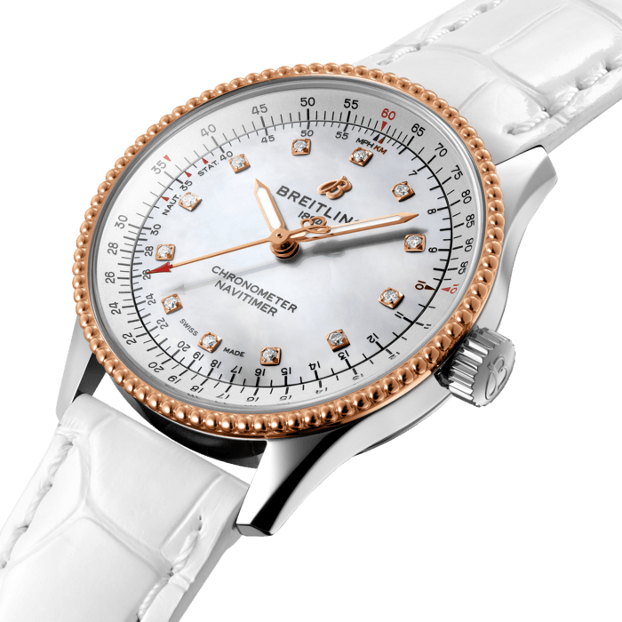 Refined and elegant, the Navitimer Automatic 35 combines the historic appeal of a true icon with the sophistication of a contemporary timepiece.
Available in a variety of materials including stainless steel and 18k red gold, the 35 mm case features a beaded bezel and a range of elegant dial colors, as well as diamond-set white mother of pearl. Offered either with a matching bracelet or alligator strap that fits both a stainless steel pin or folding buckle, the Navitimer Automatic 35 is powered by the Breitling Caliber 17, a COSC-certified chronometer.