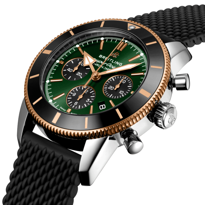 Inspired by the original Superocean from the 1950s, the Superocean Heritage combines iconic design features with a modern touch. Sporty and elegant, the Superocean Heritage is a true embodiment of style at sea.
Featuring the iconic triangular-shaped hands as well as a unidirectional bezel with a polished ceramic ring, the Superocean Heritage is an elegant looking diver’s watch. Limited to 500 pieces, this Superocean Heritage B01 Chronograph 44 features a range stainless steel & 18k red gold case and a green dial. Offered with a black “mesh-styled” rubber strap fitting a folding buckle, this Superocean Heritage is powered by the in-house Breitling Manufacture Caliber 01, a COSC-certified chronometer.