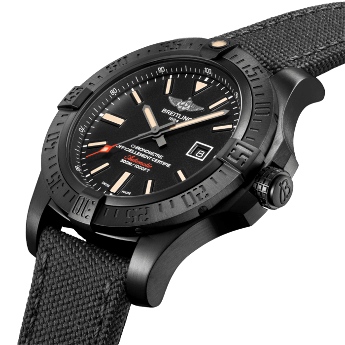 The high-performance, accurate and functional Avenger Blackbird, available in 44 mm and 48 mm, embodies a concentrated blend of the Breitling spirit. Its watchword is “power in action”. The light and sturdy titanium case features a highly resistant black carbon-based treatment, resulting in a “stealthy” aesthetic accentuated by its satin-brushed appearance. The dial is defined by its excellent readability, while the unidirectional rotating bezel with rider tabs keeps extremely precise count of flight or dive times. This vocation for top flight accomplishments is also reflected in the military-style anthracite strap in an ultra-durable high-tech fabric.