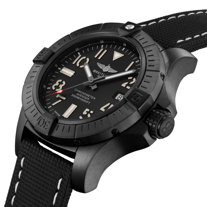 Bold, extremely robust and shock resistant, the Avenger Automatic 45 Seawolf is a lightweight pilots’ watch prepared for adventures well below the ocean’s surface (up to 300 bars - 3.000m). As a true Breitling Avenger, it can be used wearing gloves and offers unrivalled safety and reliability to any airborne adventurer. The Night Mission interpretation of the Avenger Automatic 45 Seawolf features a sturdy 45mm DLC-coated titanium case, black dial and a black military leather strap that fits either a DLC-coated stainless-steel pin buckle or folding clasp. Its specific Arabic numerals recall the stenciled numbers used on the decks of aircraft carriers. With an impressive water resistance, the Seawolf is at ease up in the air and deep down the oceans. Thanks to its rugged bezel and its special grip-pattern on the crown, the Avenger Automatic 45 Seawolf Night Mission can be easily operated wearing gloves.