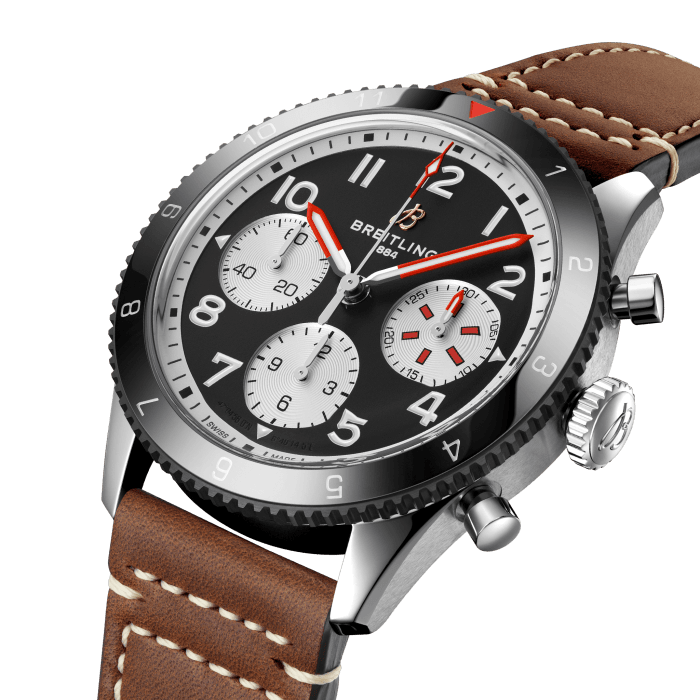 From brave first takeoffs to the birth of commercial air travel, Breitling’s history is inseparable from that of flight. In the 1930s, Breitling’s Huit Aviation department made its name inventing precision cockpit clocks. Two decades later, it introduced yet another novel flight instrument, this time in wearable form: the Ref. 765 AVI. That pioneering pilot’s watch provided the technical backdrop for today’s Classic AVI, a collection inspired by the rugged spirit of famed early aircraft.
The Classic AVI Mosquito honors one of those legends. In an era when aluminum and steel shortages were common, the engineers behind the de Havilland Mosquito made use of a still plentiful material: wood. The “Wooden Wonder” caused shockwaves when it outperformed its metal contemporaries to become one of the fastest planes built between 1940 and 1950. Its superior maneuverability allowed it to multitask in roles as far ranging as light bomber, night-fighter, transport and photographic reconnaissance aircraft.
As a true pilot’s watch designed to withstand the rigors of a vintage cockpit, the Classic AVI Mosquito features large, highly legible Arabic numerals on the dial and bezel.
The knurled bezel on the 42mm case provides optimal grip, even in a pilot’s gloved hands. Top-stitched calfskin straps give a nod to the seams found on classic flight gear, while the stainless-steel bracelet provides an elegant alternative. Pilots and other travelers will appreciate its legibility, wearability, and understated style. The engine of the Classic AVI is the COSC-certified Breitling Caliber 23 movement, which provides approximately 48-hours of power reserve.